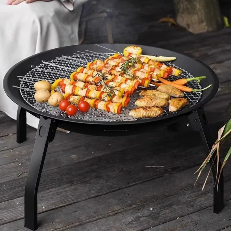 Portable Alpine Outdoor Supplies wood camping stove with removable circular grill and firewood burner for outdoor cooking.